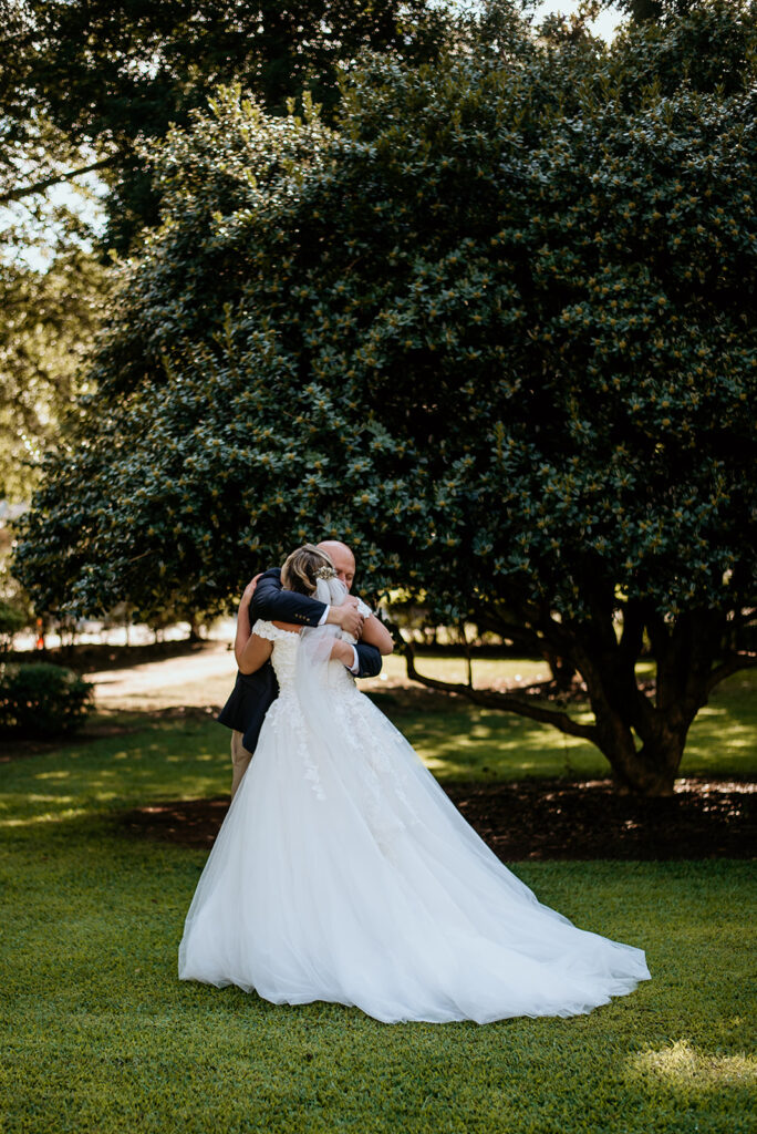 bride and father hugging