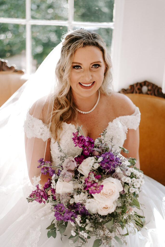 bridal portrait on orange couch at Naylor Hall
