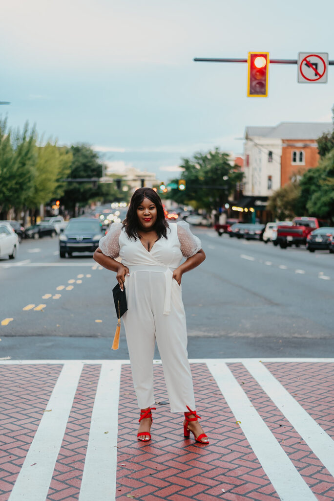 Graduate standing in the middle of street in downtown athens georgia