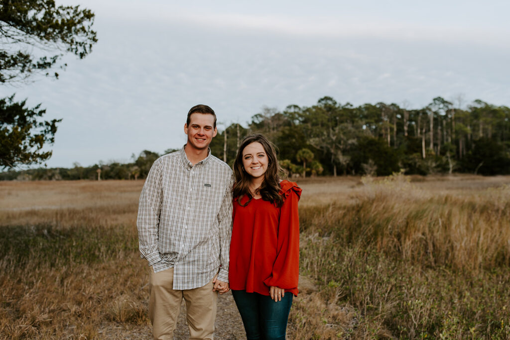 couple holding hands at skidaway island in savannah georgia