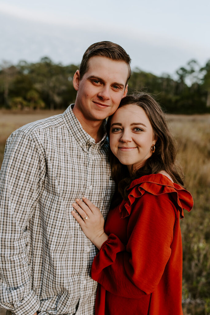 couple smiling at skidaway island for engagement session
