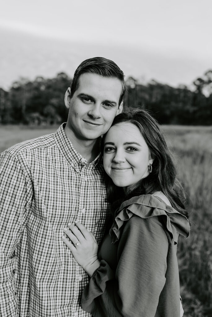 couple smiling at skidaway island for engagement session
