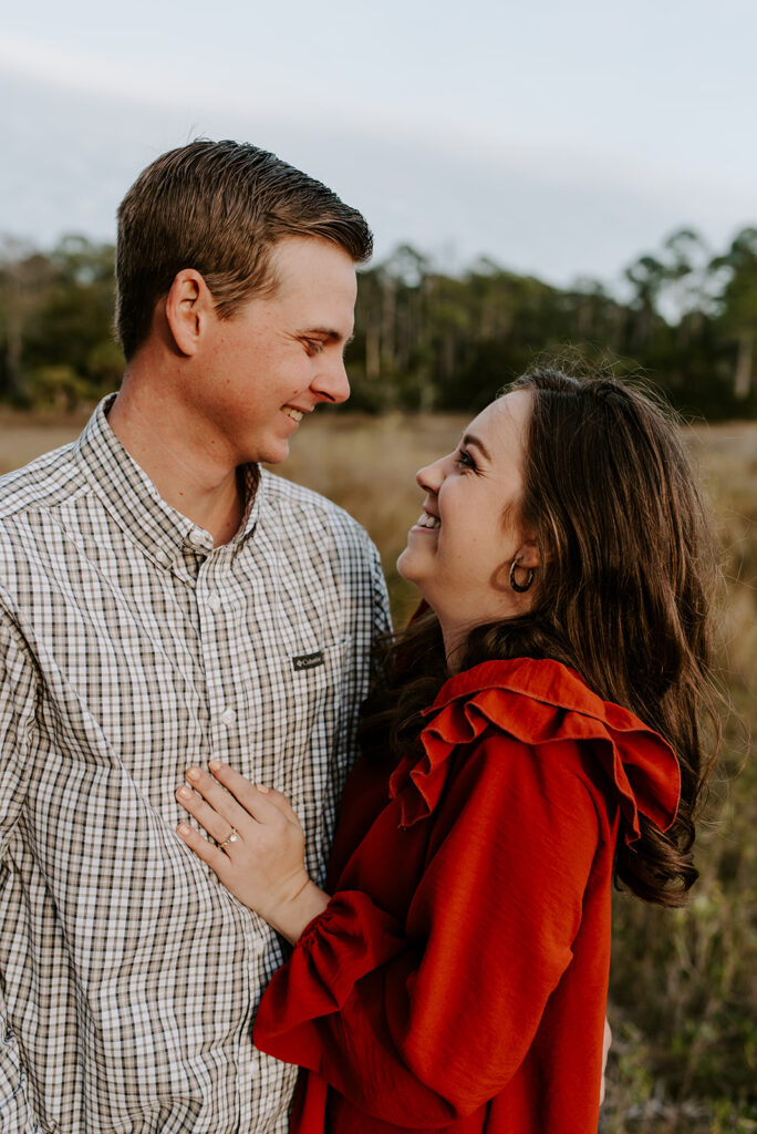 couple smiling at each other at skidaway island state park