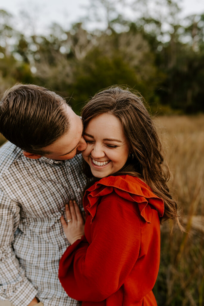 engaged couple laughing at skidaway island engagement session