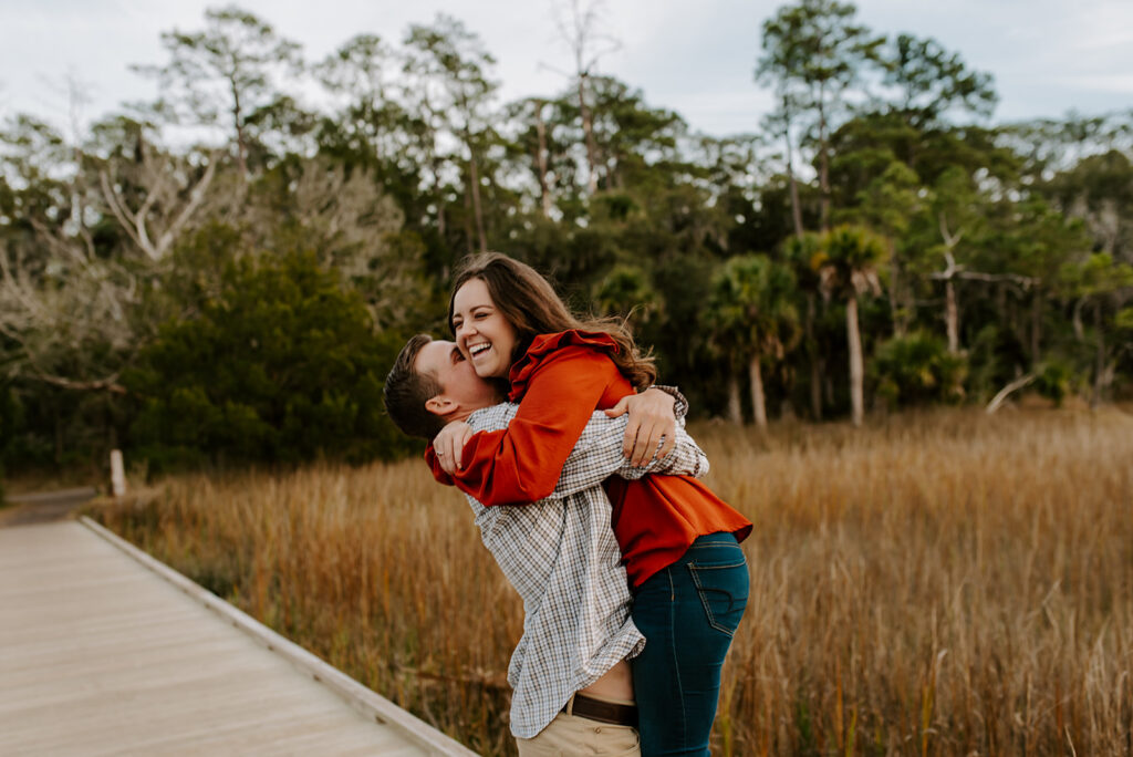engaged couple laughing at skidaway island engagement session
