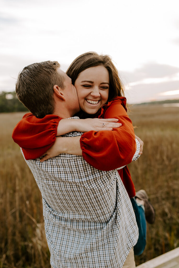 engaged couple laughing at skidaway island engagement session