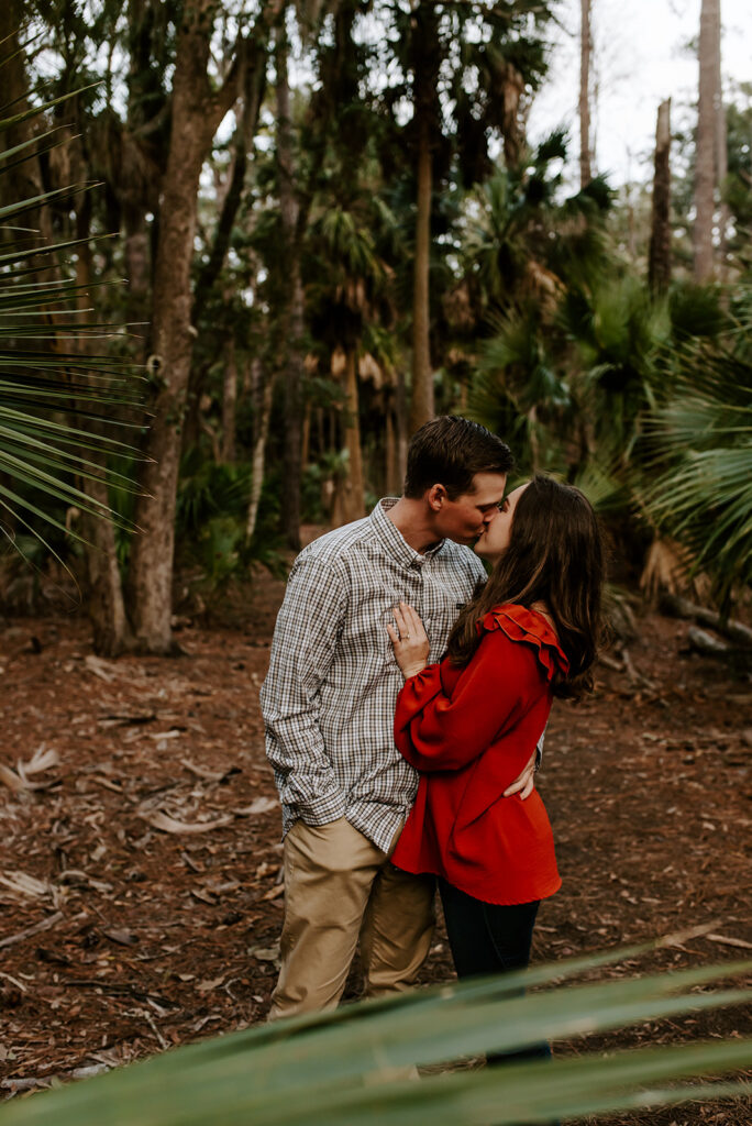 engaged couple kissing at skidaway island engagement session