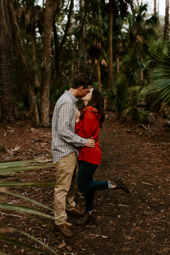 engaged couple kissing at skidaway island engagement session