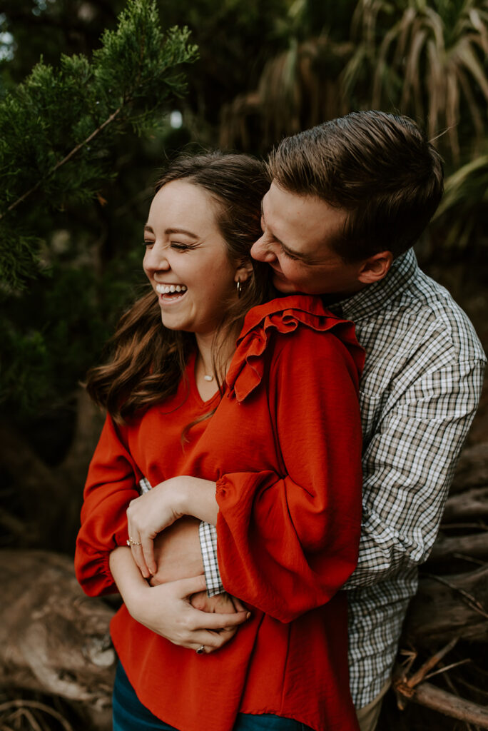 engaged couple laughing at skidaway island engagement session