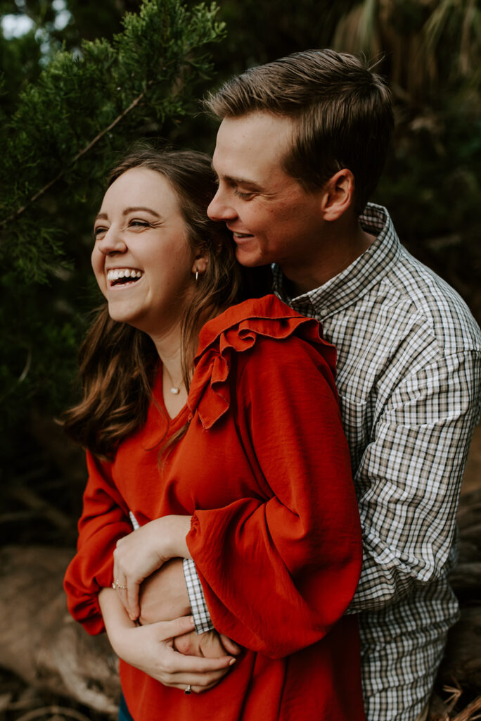 engaged couple laughing at skidaway island engagement session