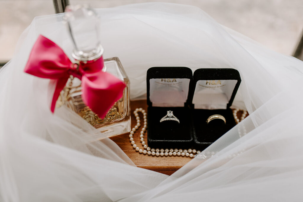 juicy coutoure perfume with pearls and wedding day rings