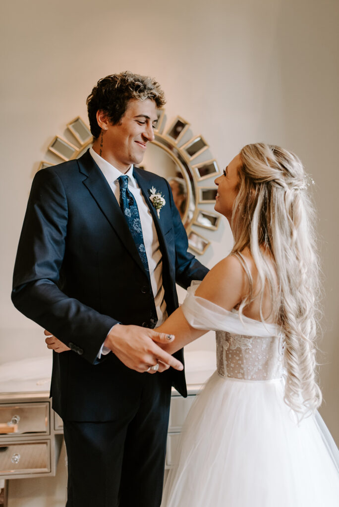 first look between bride and her brother at summerour studio