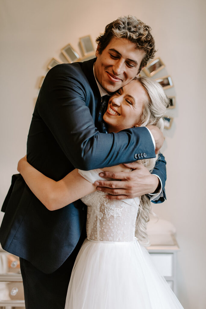 first look between bride and her brother at summerour studio