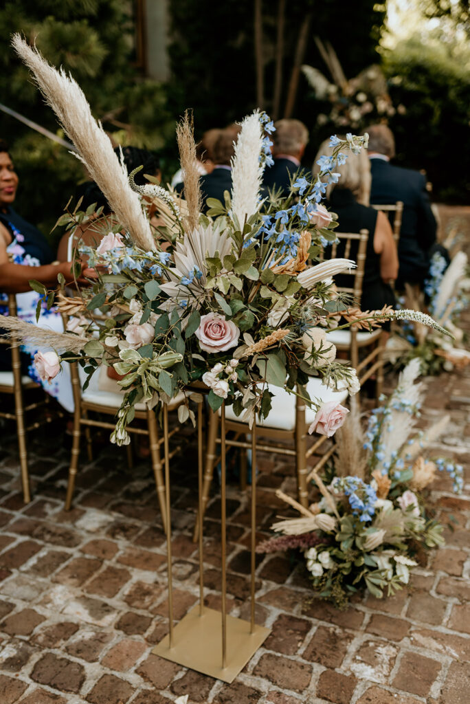 boho flowers decorating the aisle at summerour studio