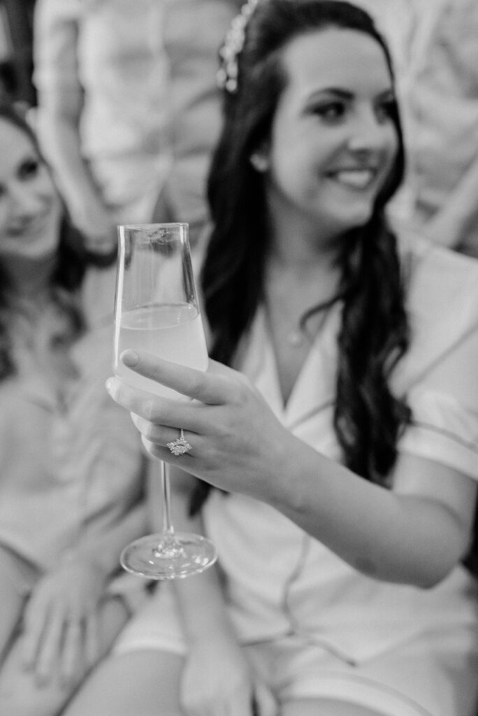 bride holding champagne glass