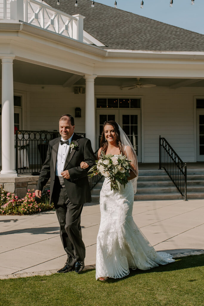 father walking the bride down the aisle at the reserve club