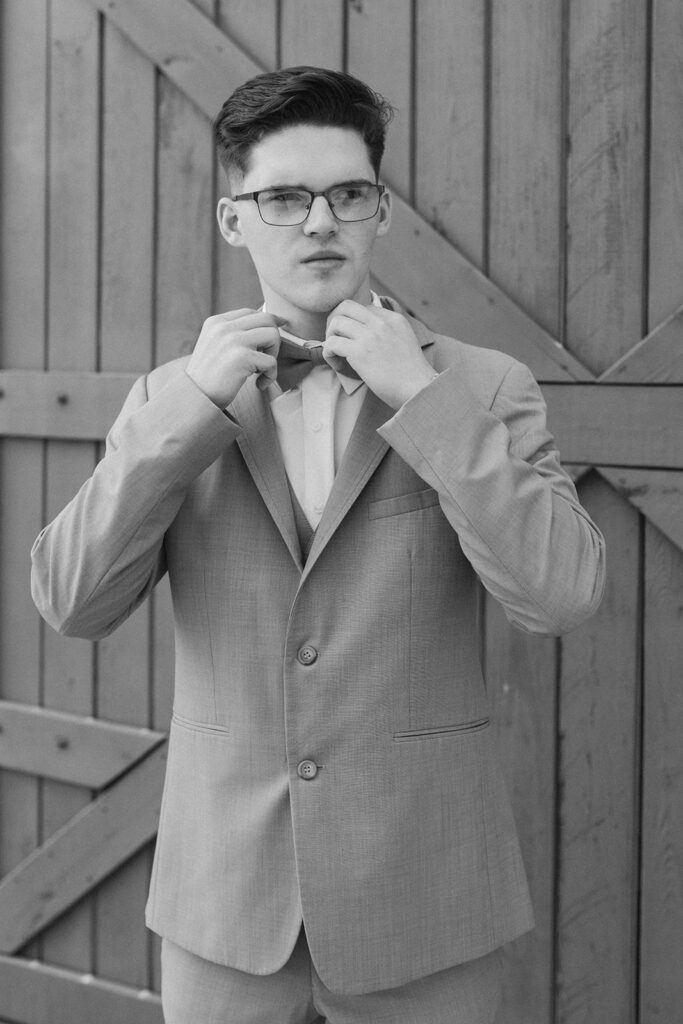 groom getting ready at dutch ford farm