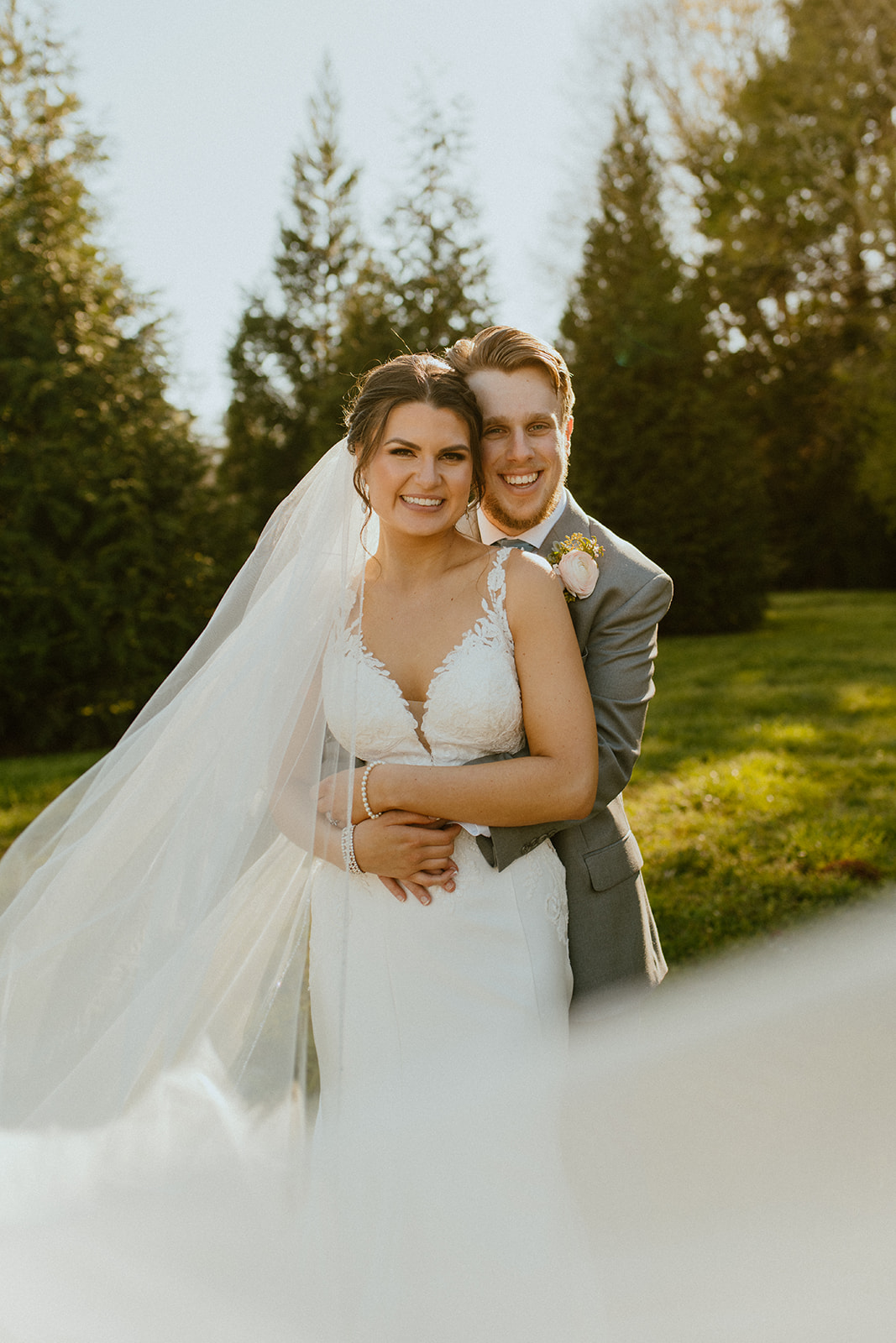 bride and groom smiling at camera